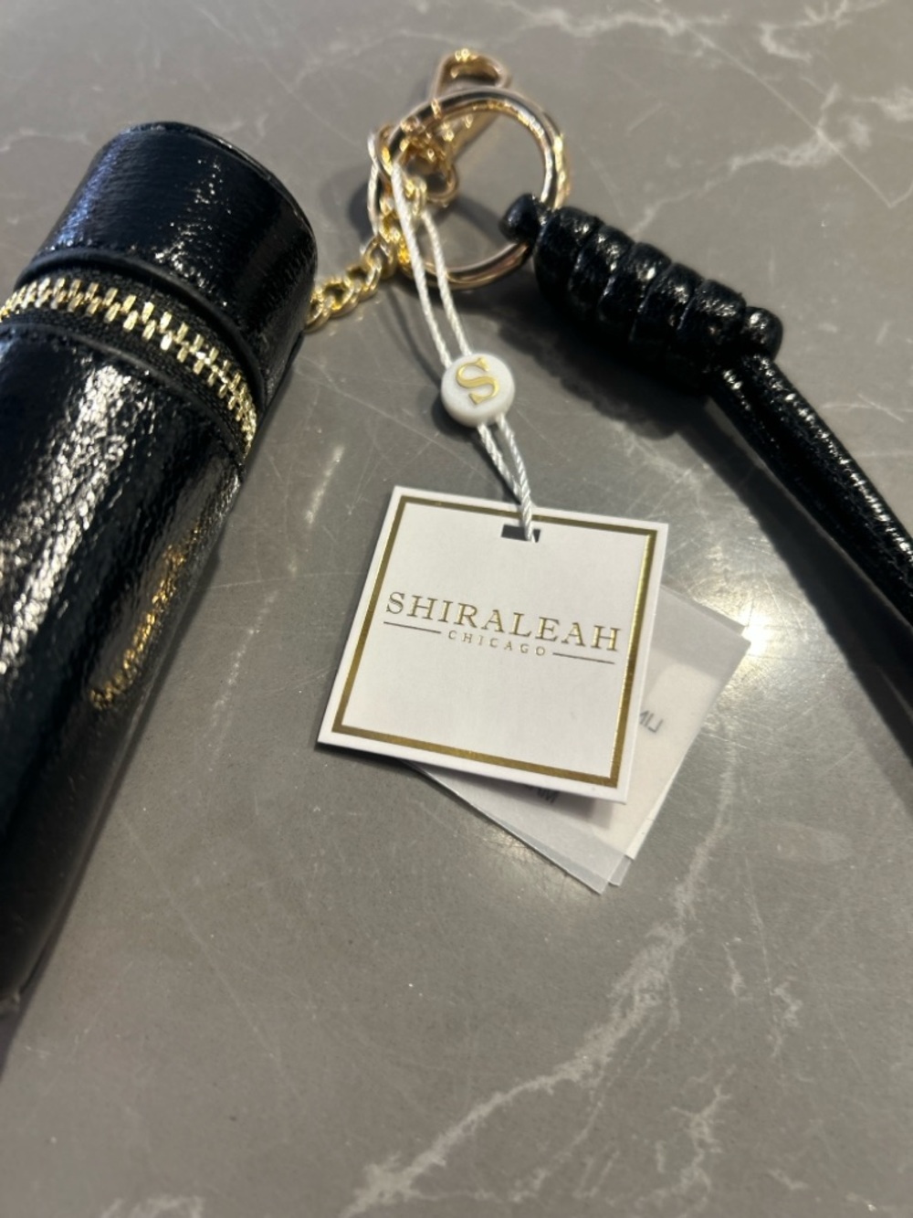 Shiraleah Black Patent Lipstick Case Keychain with Gold Hardware - Picture 8 of 11